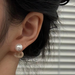 A pair of S925 silver pig nose pearl earrings set with white zircon(without pearl)